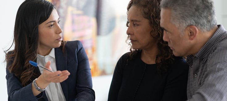 An attorney consults with a woman and a man. You’ll have to weigh whether LegalZoom would be as good for your business as an in-person legal consultation.