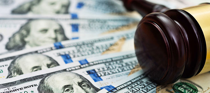 A gavel rests on an array of 0 bills. Costs vary for online legal services.