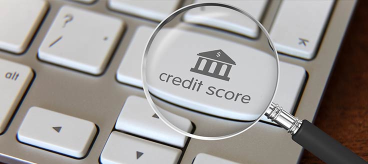 A magnifying glass over the words "credit score"