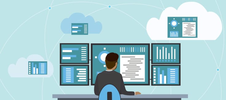 A worker sits in front of several monitors. The business cycle impacts all parts of the economy, whether you play a large or small role in it.