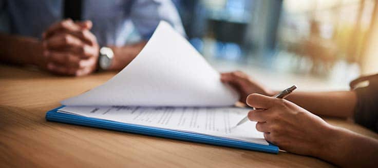 A business owner looking through a loan application.