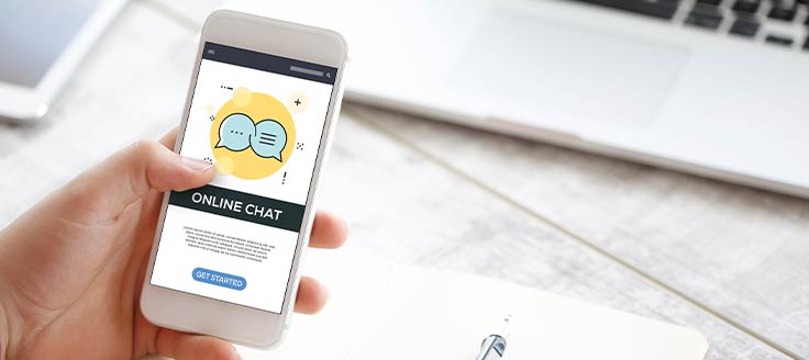 A person has their smartphone open to a messaging app.