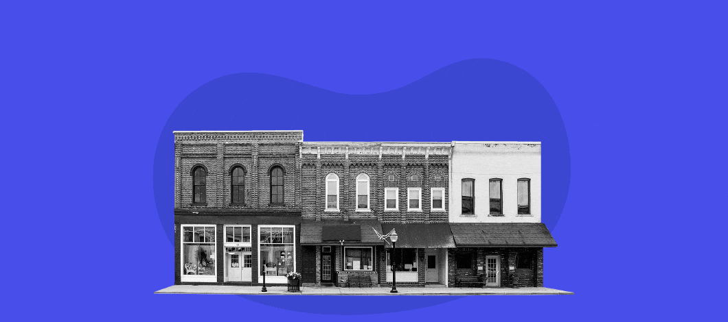 Moving image showing a row of building storefronts with an upward trending line graph above them with percentage signs and the words “loan rates”