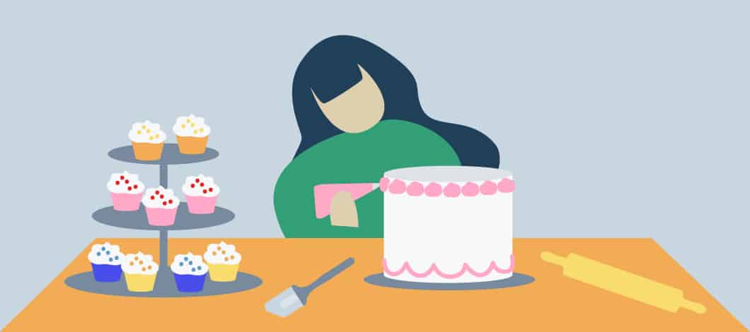 Woman decorating a cake