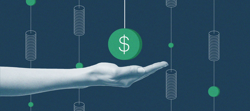A hand hovers under a ball with a dollar sign.
