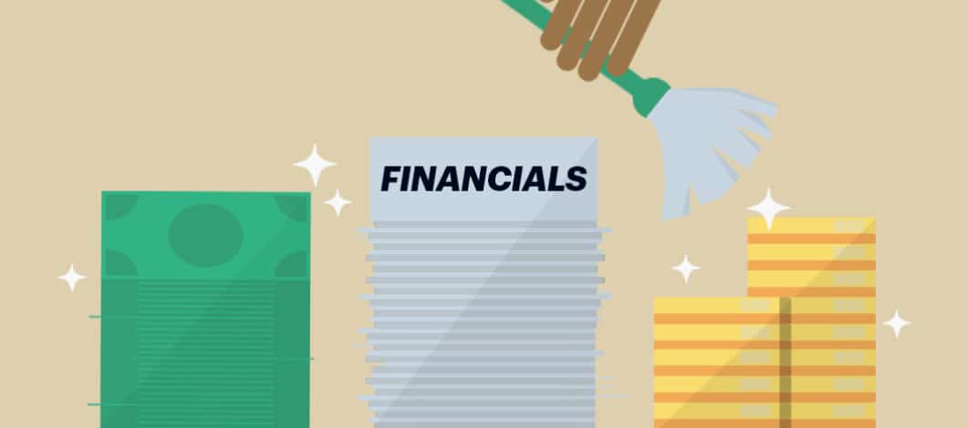 A hand holding a feather duster cleans papers that read “Financials” as well as dollar bills and coins.