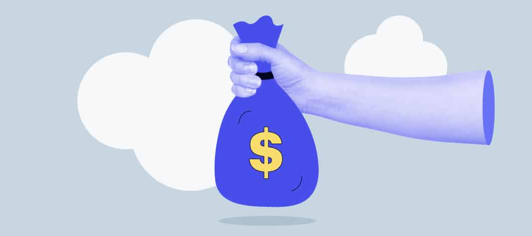 A hand holds a sack of cash.