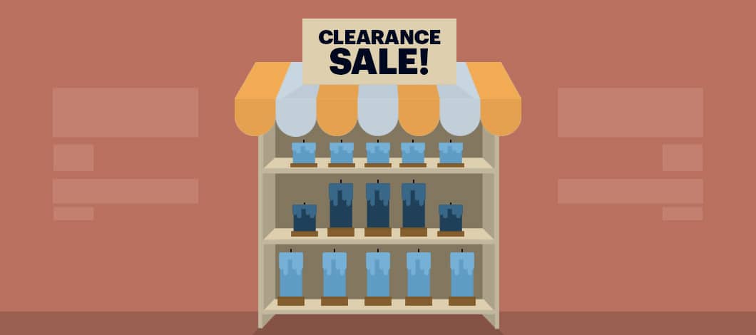 In a shop, shelves are filled with blue candles. There’s a sign that reads “Clearance Sale!”
