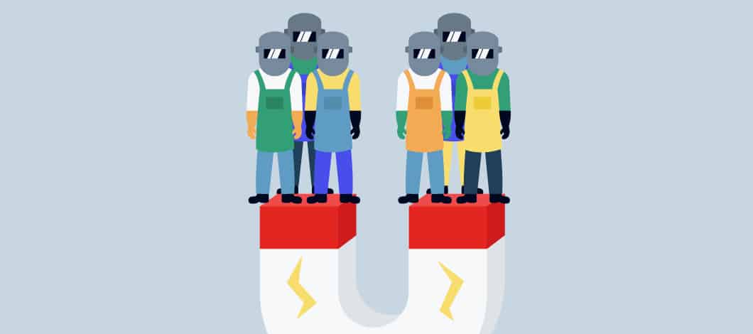 A big magnet has attracted several welders wearing protective masks and gloves.