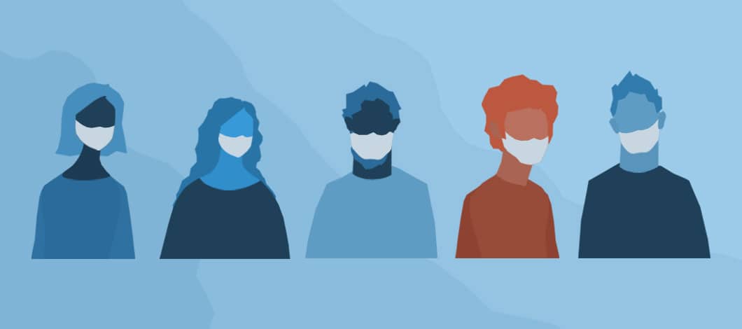 We see the masked heads and torsos of 5 co-workers distanced, but standing side by side. Four of them are blue in color. One person, the second from the right, is red.