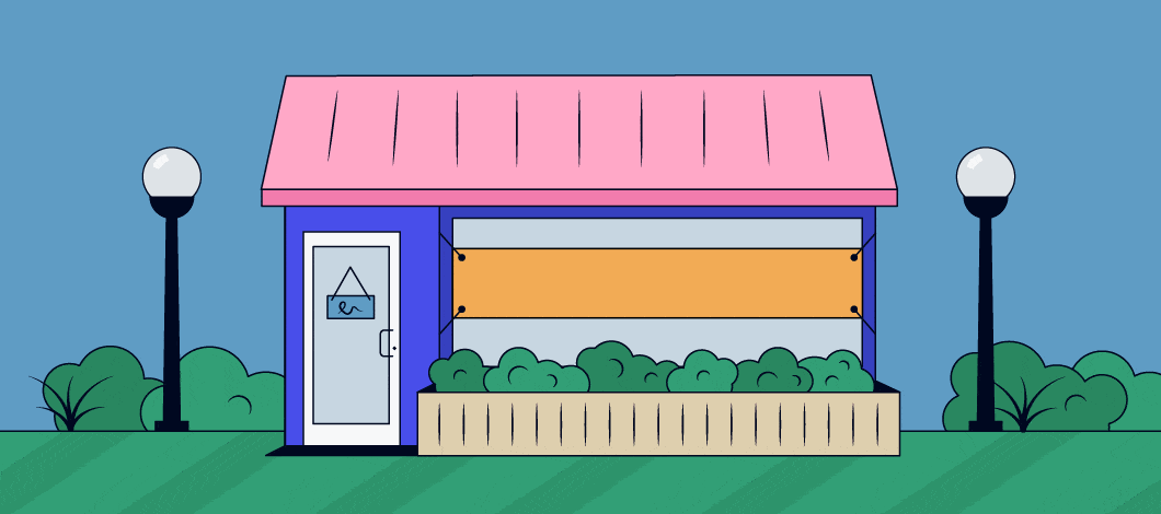 A banner sign over a small shop window reads “Small Business Saturday!”