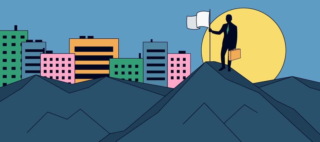 A businessman has reached the summit of a mountain and plants a flag in celebration. The background is a cityscape.